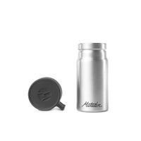 Front of canister with lid off on white background