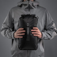 Man holding dry bag in front of him